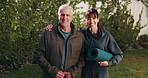 Yoga mat, senior and couple hug outdoor for bonding with exercise, wellness and morning routine. Marriage, happy and portrait of mature man and woman embrace for fitness, health and love in backyard
