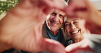 Heart hands, happy and face of old couple outdoor for romantic connection, support and bonding. Partner, trust and commitment gesture with senior man and woman in backyard of home for loyalty