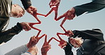 People, senior or hands together with star shape for fitness, exercise or outdoor mission below blue sky. Low angle, elderly or active group with symbol, peace sign or synergy for community wellness
