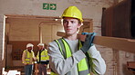 Carpenter, walk and man with lumber in workshop, manufacturing and material for furniture production. Warehouse, artisan and person with timber, serious and plank for woodworking project and flare