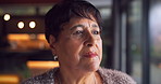 Serious, thinking and senior woman in home with deep thoughts, perspective or remember past memory. Retirement, reflection and person by window for view, introspection or flashback with vision