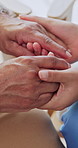 Solidarity, old person or nurse in home with holding hands, understanding or empathy in health assistance. Tender, senior woman or caregiver with comforting, patient support or trust in medical care.