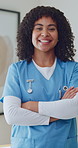 Pride, face or nurse in clinic with arms crossed, wellness service or ambition in medical career. Happy, portrait or woman with confidence, hospital practitioner or about us in healthcare industry.