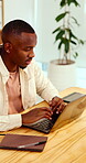 Serious, research and man with laptop in business, copywriting and planning for article or creative. Copywriter, above and black person with technology, email marketing and blog on app in office