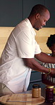 Packing, lunchbox and dad with child in kitchen, back to school and getting ready with son in house. Happy, family and black man with healthy food for kid, education and morning routine in home