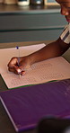 Boy, learning and writing with book in home for mathematics, education or assessment. Child, kid or thinking with notebook, numbers or equations for problem solving, homework or assignment in house