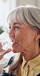 Senior, drink and happy woman with water in home for hydration, sustainability or nutrition. Elderly, female person or mineral liquid with smile or glass for vitamins, diet or digestion in house