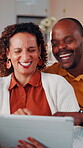 Laughing, couple and relax with tablet in home, entertainment and watching comedy on break in lounge. Interracial, relationship and mature people with technology, happy and funny movies in house