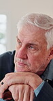 Thinking, sad and old man in house with walking stick, memory loss or reflection on past mistake. Mental health, regret or elderly person with disability, alzheimer or upset flashback in retirement.