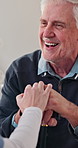 Holding hands, nurse and old man laughing with walking stick in home living room for good news. Cane, funny and support of caregiver with happy senior person for consulting, feedback or retirement