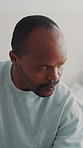 Stress, thinking and black man with anxiety in home, financial struggle or worry for debt crisis. Deep thoughts, reflection and mature person with depression for bankruptcy challenge, risk or pensive
