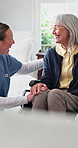 Wheelchair, nurse and laugh with senior woman in home care, medical support and happiness. Smile, caregiver or person with disability, healthcare chat or funny joke with assisted living in retirement