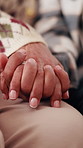 Old couple, relax and holding hands in home for love, compassion and partner support for loyalty. Senior people, rest or romantic with gratitude, understanding and respect for relationship commitment