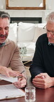 Men, discussion and financial advisor with document in home, wealth assessment or investment update. Asset management, consultation and advice for senior person, talking and retirement plan in house