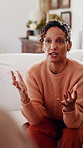 Woman, couple and fight on couch with stress, blame or accountability for unshared responsibility. Mature wife, partner and frustrated in home with disagreement, crisis or argue in toxic relationship