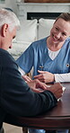 Documents, healthcare and signature of old man with nurse for insurance or sign up. Approval, clipboard and paperwork with caregiver speaking to senior couple for advice or medical consulting