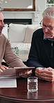Men, discussion and financial advisor with clipboard in home, wealth assessment or investment update. Asset management, consultation and advice for senior person, talk and explaining report in house