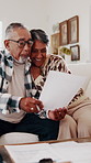 Old couple, documents and bills for home budget, insurance contract or asset management success. Excited, elderly people and paperwork on sofa for funding, approval or conversation for loan agreement