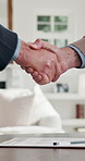 Real estate, offer or handshake in house with contract, sale acceptance or deal closing in meeting. Partnership, men or realtors with shaking hands, home transfer or success in investment negotiation