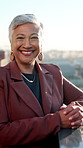 Face, business and woman on rooftop with smile, career pride and about us for real estate. Portrait, mature realtor and laughing on terrace with ambition, urban housing and infrastructure development