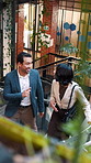 People, talk and stairs in office with sustainable business, project proposal or arrival at workplace. Above, team and walk on steps with eco friendly company, environmentalist advice and meeting.