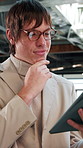 Office, thinking and business man with tablet for economy news, investment evaluation or reading email. Tech, consultant and person at workplace with idea for enterprise review or financial plan