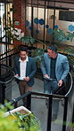Business, sustainability and men in office with tablet, eco friendly project discussion or ESG research. Above, people walk and talk on stairs with tech, insight and advice for go green campaign.