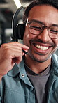 Businessman, consultant or talking with headset in office for customer service or telecommunications. Happy man, employee or friendly agent speaking with smile or mic for online advice or help