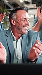 Team, applause and mature man with laptop in office, laugh and celebration for financial achievement. Asset manager, clapping and happy people with technology, success and excited with colleagues
