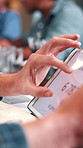 Hand, person or tablet screen with stats in meeting for web traffic, campaign metrics or KPI. Office, marketing manager or tech with scroll for ads revenue graph, SEO algorithm or media buying system