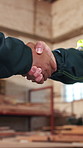 Meeting, welcome and people with handshake in woodwork warehouse for building or planning. Manufacturing, factory team and men with shaking hands for workshop, safety and compliance or maintenance