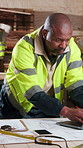 Laptop, man or blueprint in carpentry workshop for CAD drawing, joinery software or quality control. Carpenter, mature black person and tech for digital design, floor plan revision and shopfitting
