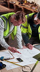 Blueprint, talking and people in workshop for construction material, renovation project or collaboration. Meeting, team and men with documents, remodeling design and planning with building contractor