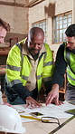 Blueprint, planning and men in workshop for construction material, renovation project and carpentry. Talking, team and people with documents, furniture design and meeting with building contractor