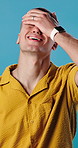Stress, upset and man in studio for regret, mistake or error with university application decline. Failure, disappointment and person with bad decision for student loans at college by blue background.