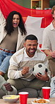 Soccer, flag and friends in home for sports game, match or tournament with victory on weekend. Cheer, happy and people with fist pump, celebrate or shout for competition, goal and support Switzerland