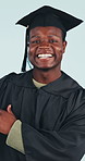 Face, graduation or black man pointing in studio for academic achievement on a blue background. Portrait, male person or student graduate with smile for education advice, advertising or learning tips