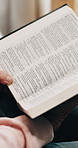 Senior person, home and hands with bible, faith and worship with holy scripture or spiritual belief. Praise, God and pensioner with book for Christianity, knowledge and Jesus Christ guidance in house