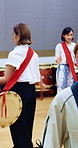 Drums, culture and women in class for learning, choreography and practice for traditional performance. Studio, Taiko and people with instruments to prepare for Japanese festival, rehearsal and rhythm