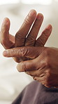Home, person and hand pain with injury, osteoporosis symptoms and tension with arthritis. Strain, sore and massage for joint ache in house with nerve inflammation, fibromyalgia and health condition
