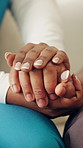 Nurse, patient and holding hands with empathy for understanding, trust or healthcare in home. Closeup, caregiver or health worker with client, support or love for sympathy, grief or comfort in house