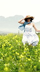 Freedom, running and smile with woman in field in nature for adventure, spring vacation and celebration. Happiness, flowers and holiday with person in countryside for peace, energy and journey