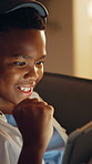 Success, headphones or kid on sofa with tablet, night activity or winner in online game. Victory, evening or black child in house with fist pump, best score or achievement in digital competition.