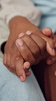 Comfort, holding hands and couple in home for connection, bonding or support in marriage in living room. Trust, love and man with woman for commitment, safety or solidarity in relationship at house.