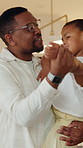 Dancing, happy and father with child in home with music, radio or playlist for bonding together. Smile, connection and African kid with dad for moving to song in kitchen at apartment on weekend.