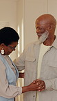 Dancing, happy and black couple in home with music, radio or playlist for bonding together. Smile, connection and mature man with woman for moving to song on album in kitchen at apartment on weekend.