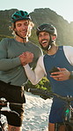 People, handshake and bicycle at beach for fitness, good news and cycling success of triathlon. Smile, cyclists and cheering in nature with phone, distance record and progress for biking achievement