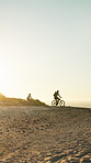 Sunset, friends and exercise outdoor with mountain bike, fitness and helmet for adventure together. Space, people and off road cycling in nature with safety gear, endurance training or sports workout