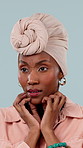 Black woman, anxiety and fear in studio with mental health, nerves and caution. Afraid, stress and worry with drama, hiding and search for danger, scary with phobia isolated on blue background