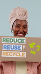 Face, recycle and black woman with billboard for eco friendly development on a studio background. Portrait, happy activist or female person with smile, poster or reuse sign for earth day campaign
